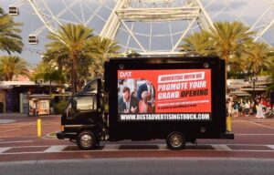 Promote your grand opening on a digital advertising truck